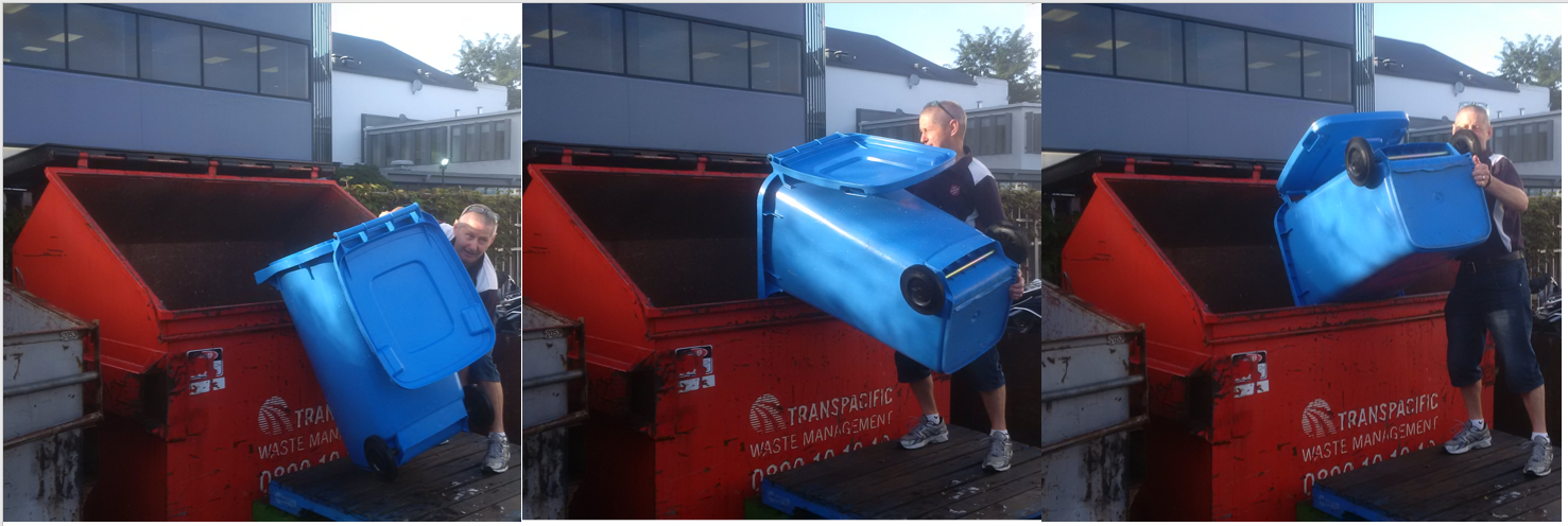 Staff at Salvation Army Hamilton manually emptying bins of waste